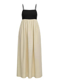 Black top and beige skirt dress on a white background